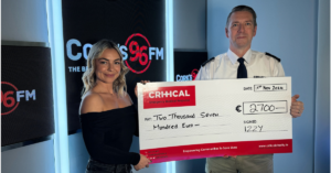 CRITICAL CEO David Tighe accepts a cheque for €2,700 from Isabel Bartak-Healy, Izzy Showbizzy of Cork’s 96FM, who participated in a challenging Camino trek to raise money for the charity.